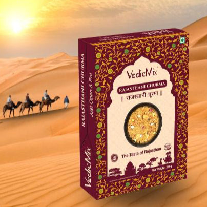 Packaging of VedicMix Rajasthani Churma with an image of desert landscape and camels in the background.