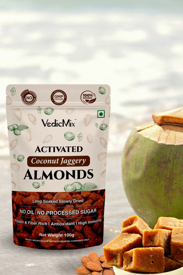 Packaging of VedicMix Activated Coconut Jaggery Almonds with whole almonds, coconut pieces, and syrup displayed in the foreground.